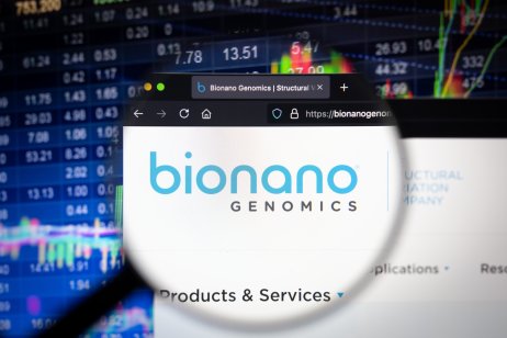 KAUFBEUREN, GERMANY - JUNE 12, 2021: Bionano Genomics company logo on a website with blurry stock market developments in the background, seen on a computer screen through a magnifying glass.