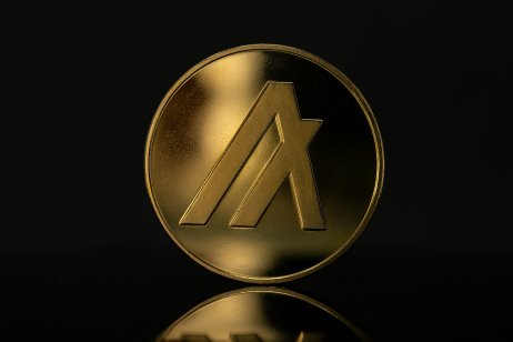 Algorand ALGO Cryptocurrency Physical coin placed on reflective surface in the dark background