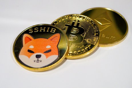 Stack of Cryptocurrency with Shiba Inu coin on top of Bitcoin and Ethereum.