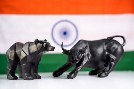 Bull and bear with Indian flag as background - Concept of investment in Indian equity Sensex share market