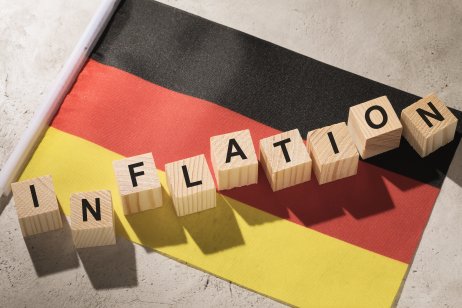 Germany flag and wooden cubes with text, concept on the theme of inflation in the country