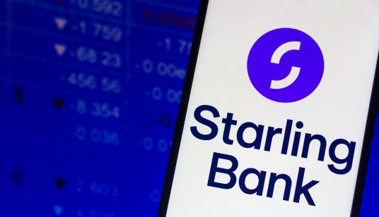 A smartphone displays the name and logo of Starling Bank