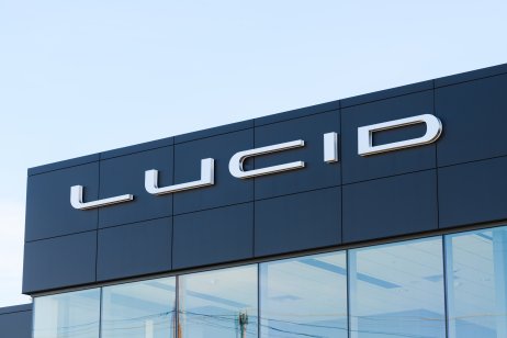 Sign on a building for the Lucid Motors brand and logo in Seattle against a clear sky