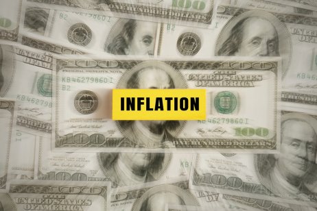 a chart showing dollar banknotes and inflation warning