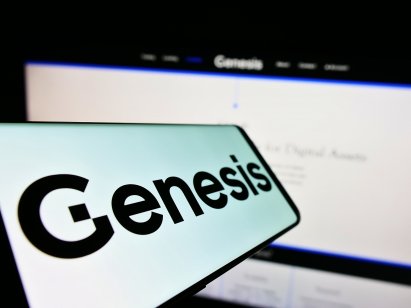 The Genesis logo appears on a smartphone