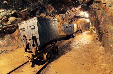 Underground gold mining carts on a rail
