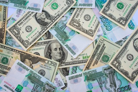 US dollar banknotes and Russian ruble banknotes
