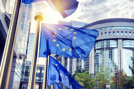 EU flags waving outside the European Parliament