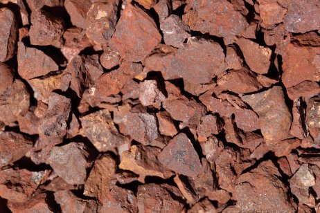 A macro photo of red crushed iron ore.