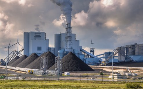 Coal stockpiles in front of a plant 