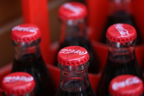 Coca cola red bottles in a row