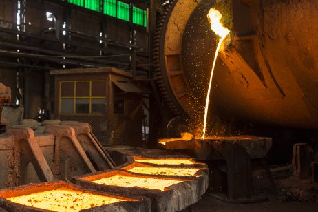 A smelter processing copper ore into plates
