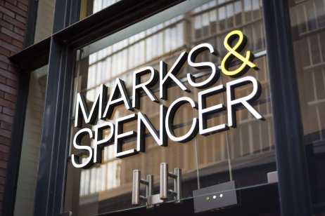 Close-up on the company name Marks & Spencer on the exterior of a store 