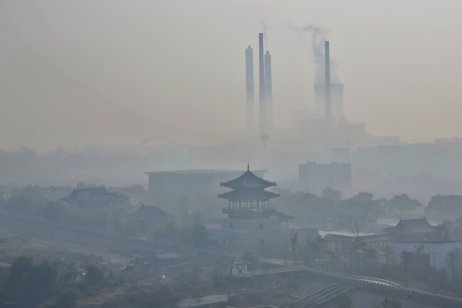 Fog and haze from a coal power plant shrouds Jiujiang City in China