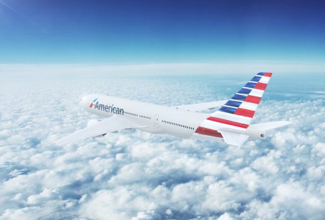 NYC, NEW YORK, UNITED STATES - CIRCA 2017: In-flight view of American Airlines Boeing 777 Commercial Passenger Aircraft Flying High Up in the Sky Above the Clouds. 3D Illustration.