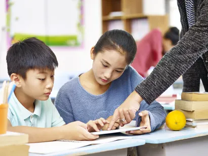 Two children studying together