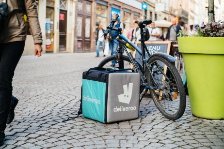 Deliveroo cargo box near bicycle in Strasbourg, France