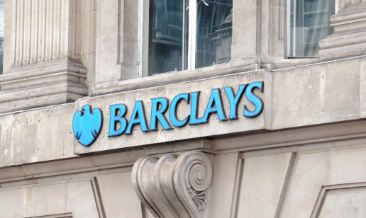 Exterior of an old stone building bearing the Barclays name and logo