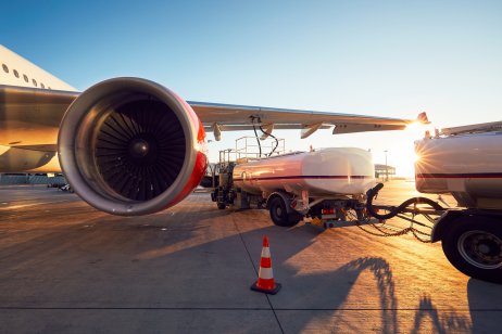 An airplane is parking in an airport's tarmac for refuelling 