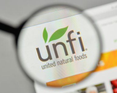 United Natural Foods logo under a magnifying glass