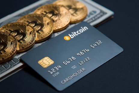 Concept bank card bitcoin on a dark background