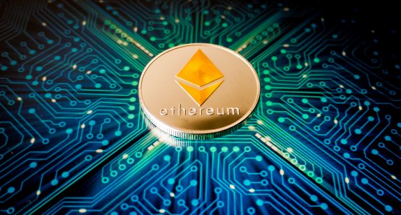 One Ethereum coin on the background of a blue circuit board