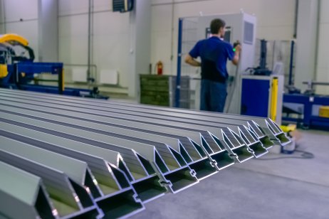 Row of aluminium profiles for construction in a factory