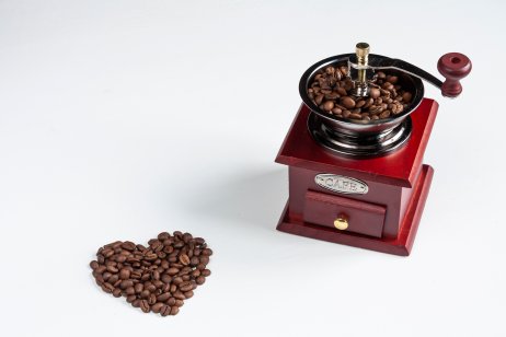Coffee bean heart and old-fashion coffee grinder