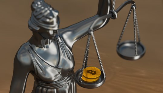 Lady Justice holding crypto