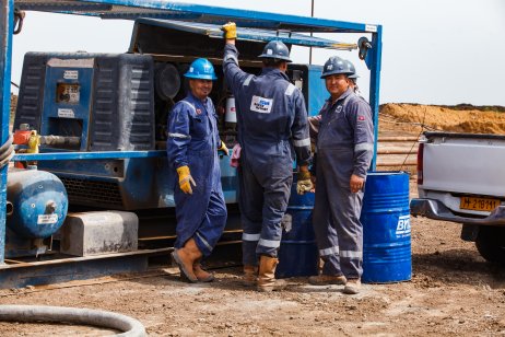 Baker Hughes workers in the oil field