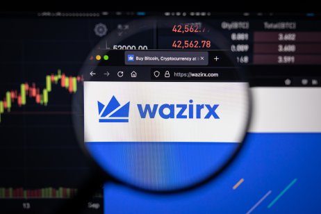 WazirX's website in front of a price chart