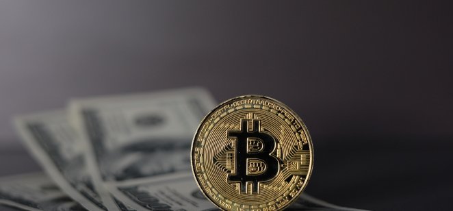 Crypto Bitcoin over dollar background