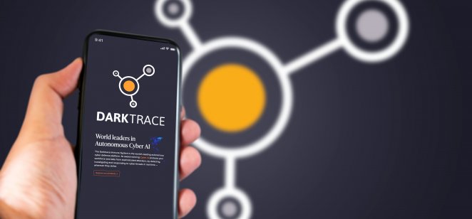 Darktrace logo on screen. Photo: Shutterstock