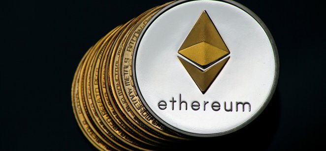 Representation of a silver Ethereum (ETH) token on a pile of bitcoins