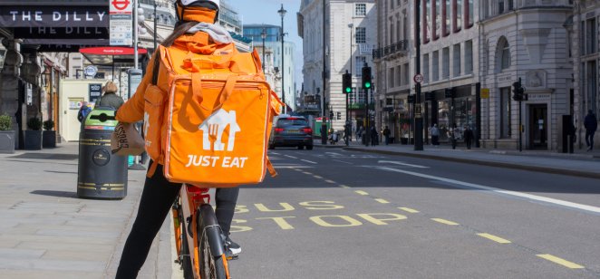delivery man for just eat on a cycle 