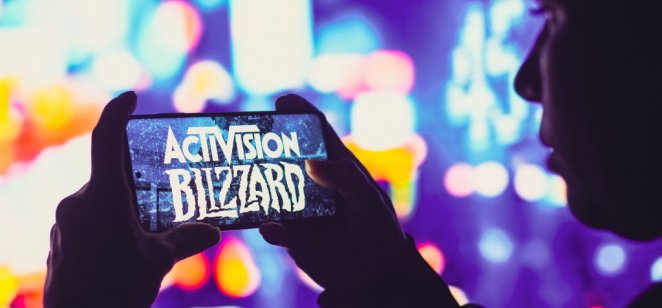 A image of Activision Blizzard logo is displayed on a smartphone