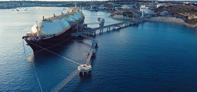A Liquified Natural Gas Floating Storage Unit (LNG FSU) moored to a jetty