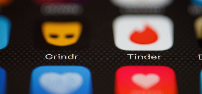 A image of the Grindr and Tinder apps on a mobile phone