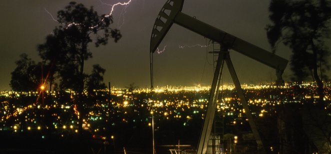 Lightning strikes the skies behind an oil pump in California, US. 