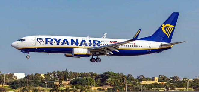 A picture of a A Boeing 737 Ryanair passenger plane is landing from the runway at malta international airport