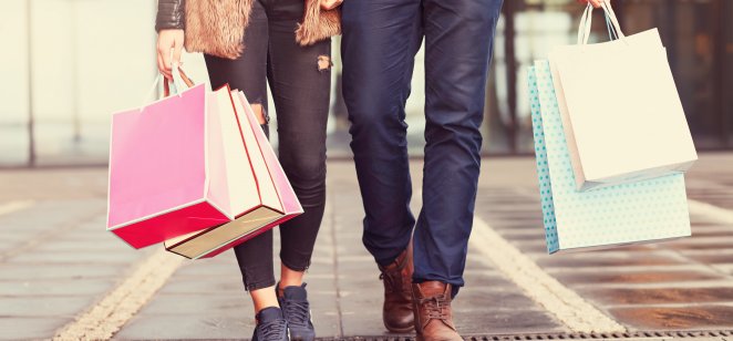 two people with shopping bags 