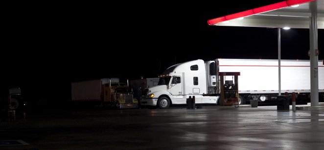 A big white truck parked at a gas station in California, US.