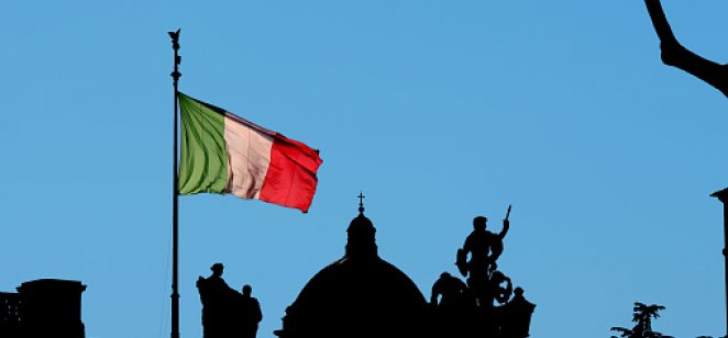 Is the 'Club Med' debt crisis back – and how soon might it dig into the euro's trajectory? Italian flag flying in late afternoon sunshine