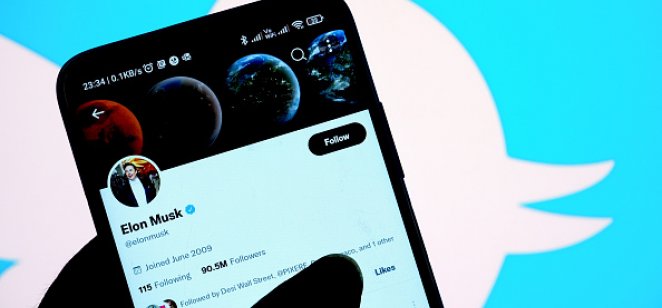Musk Twitter merger termination sends Twitter stock tumbling Elon Musk’s Twitter account is displayed on the screen of an iPhone in front of the homepage of the Twitter website