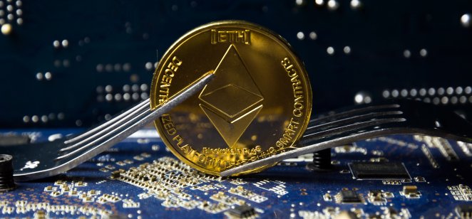 Ethereum (ETH) coin with forks on a motherboard