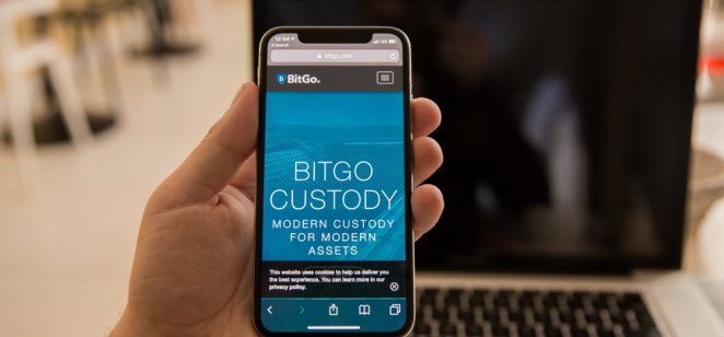 A smartphone displays the BitGo name