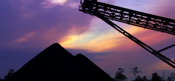 Coal pile stock at sunset