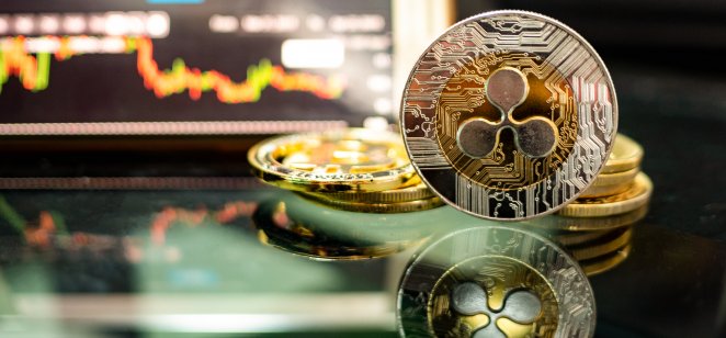 XRP coins, candle charts on the background
