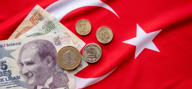 Turkish lira forecast: Will the TRY drop further? Close-up of Turkish Lira on Turkish Flag. Turkey's donation campaign. We are enough for us my turkey Turkish: Hashtag bizbizeyeteriz Turkiyem.