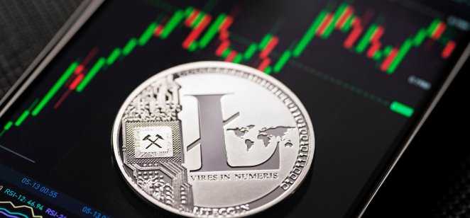 Silver litecoin cryptocurrency trading on smartphone close up